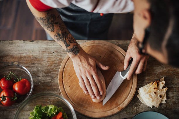 istock Top view at chef cutting chicken meat 698784164