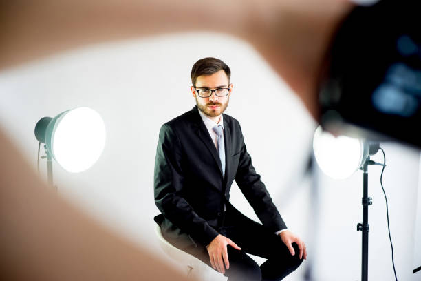 istock Photographer taking picture of a model in studio 698786270