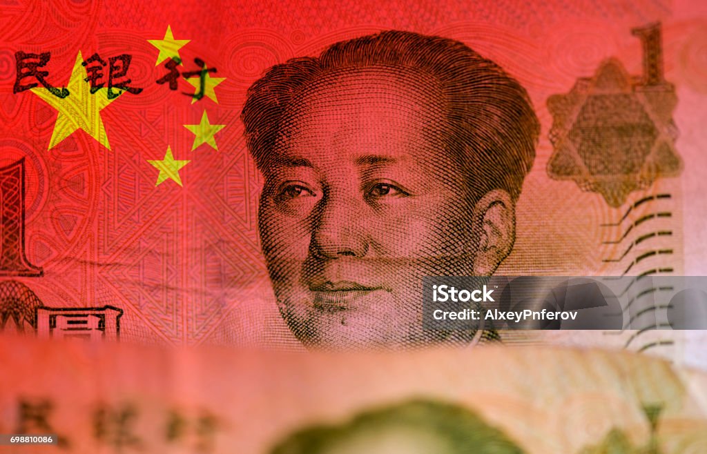 Chinese money, flag of China and face of Mao Zedong Communism Stock Photo