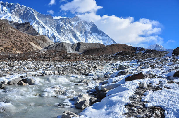 istock lobche and sulight flare from everest trek 698815514
