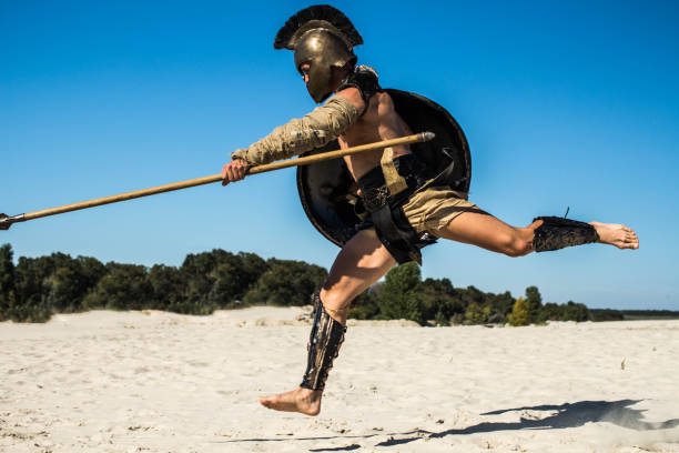 istock Strong legionnaire's legs in a jump on the opponent 698817670
