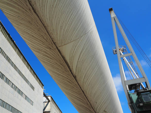 istock Cement transport tube agaisnt blue sky 698820534