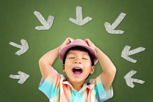 Little Asian boy with a Hat is singing song out loud. Little Asian boy with a Hat is singing song out loud. blackboard child shock screaming stock pictures, royalty-free photos & images