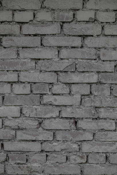 istock The old brick and stone wall with plaster 698837770