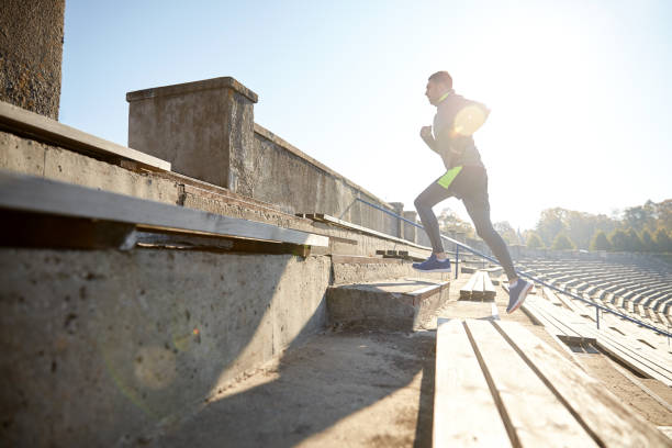 istock happy young man running upstairs on stadium 698841080