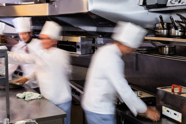 istock Team of chefs preparing food in the kitchen 698841706