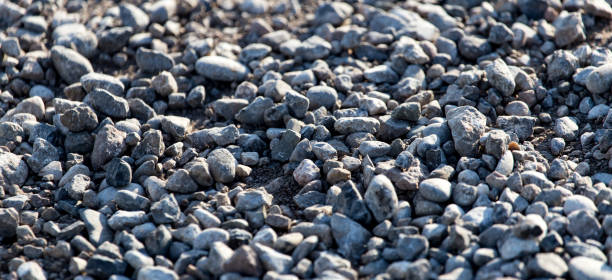 istock Crushed stone on the road as a background 698845012