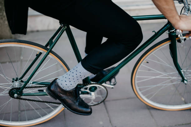 istock Close up of a person riding a bicycle 698846112