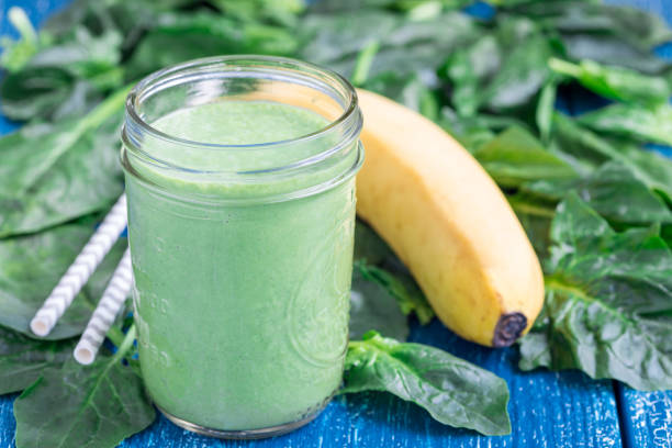 istock Detox green smoothie with spinach, pineapple, banana and yogurt, horizontal 698847236