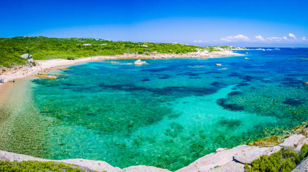 Lonely bay with azure water near Porto Pollo, Sardinia island, Italy Lonely bay with azure water near Porto Pollo, Sardinia island, Italy. catinaccio stock pictures, royalty-free photos & images