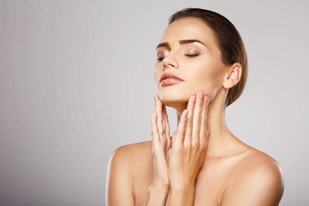 istock Beautiful girl with nude make up at studio 698877818
