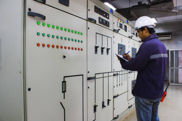 istock Engineer checking and monitoring the electrical system in the control room 698884742
