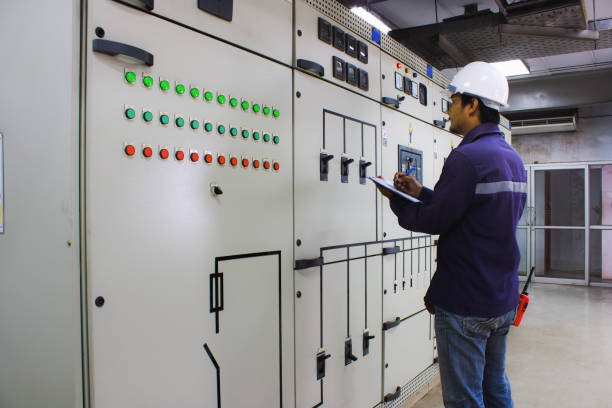 istock Engineer checking and monitoring the electrical system in the control room 698884744