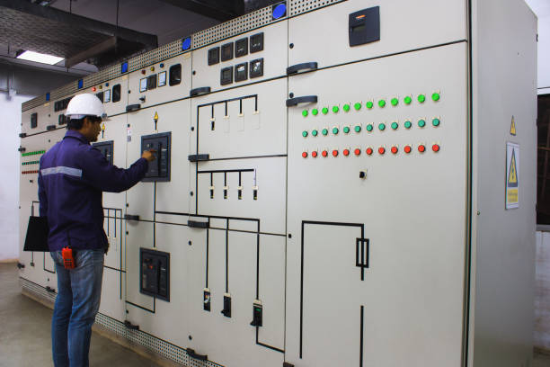 istock Engineer checking and monitoring the electrical system in the control room 698884882