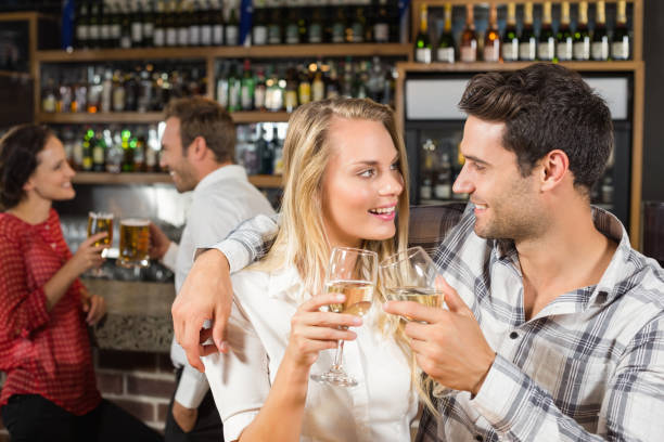 istock Couple looking at each other and toasting 698886032