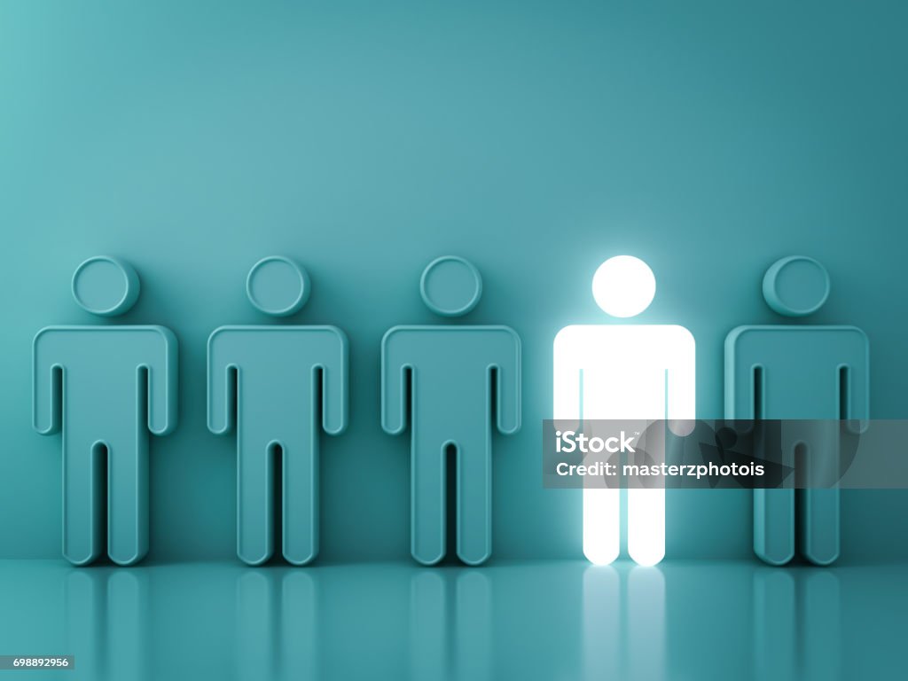 Stand out from the crowd and different creative idea concepts , One glowing light man standing among green people on green background with reflections and shadows . 3D render Stand out from the crowd and different creative idea concepts , One glowing light man standing among green people on green background with reflections and shadows . 3D rendering. Discovery Stock Photo