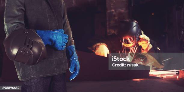 Welder In The Factory Stock Photo - Download Image Now - Welder, Automatic Welding Torch, Business Finance and Industry