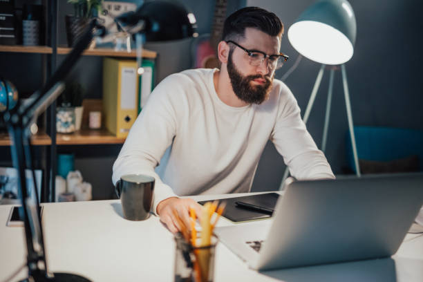 istock Late night at the home office 698902708