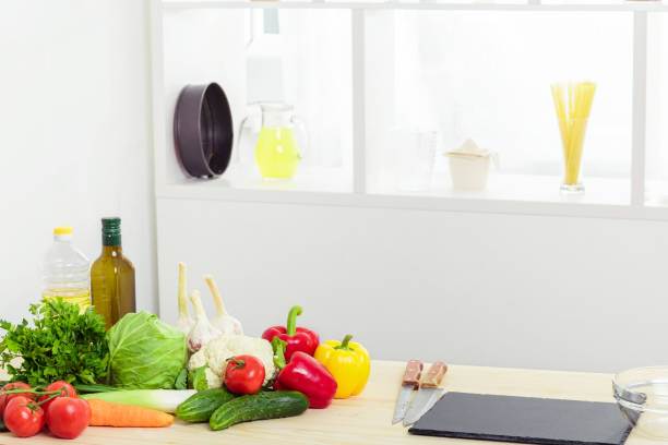 istock Fresh vegetables on kitchen table. healthy food 698917846