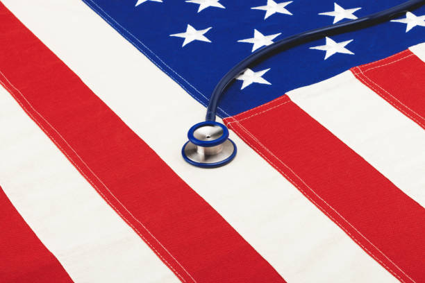 istock Stethoscope over USA flag. Filtered image: cross processed vintage effect. 698918420