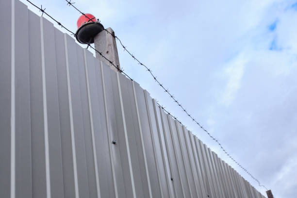 istock Barbed wire against the blue sky. 698918970