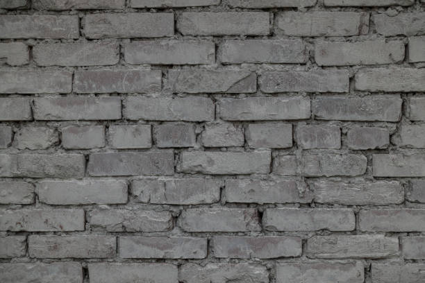 istock The old brick and stone wall with plaster 698921266