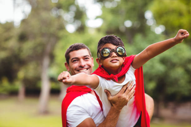 istock Father and son pretending to be superhero 698942524
