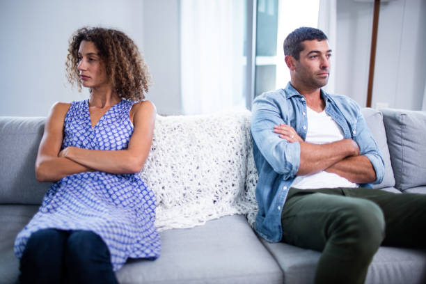 istock Upset young couple ignoring each other 698943520