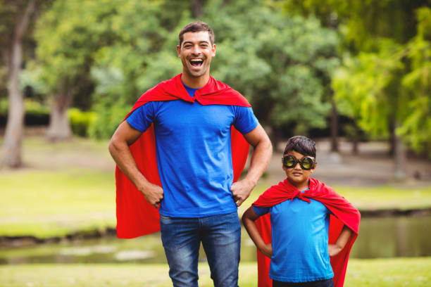 istock Father and son in superhero costume 698946680