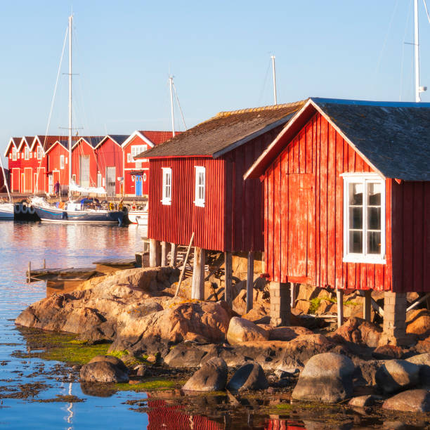 istock Old wooden boathouses on a small islet 698948966