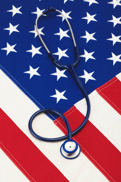 istock Medical stethoscope over USA flag - studio shoot. Filtered image: cross processed vintage effect. 698951464