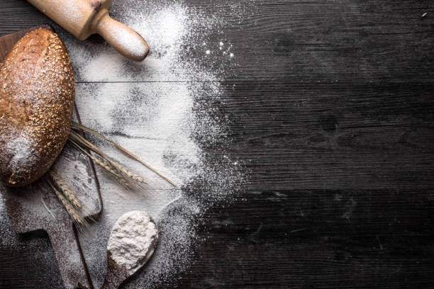 Fresh bread on a wooden background