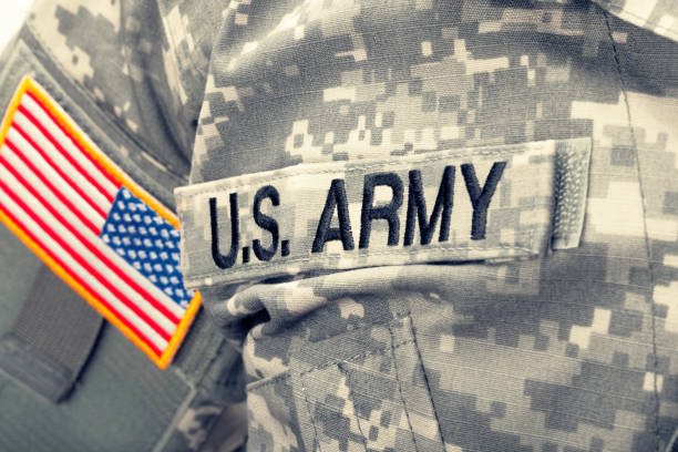 istock USA Army and flag patch on solder's uniform. Filtered image: cross processed vintage effect. 698955892