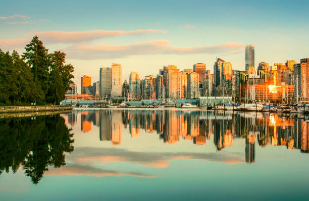 istock Vancouver skyline with Stanley Park at sunset, British Columbia, Canada 698958806