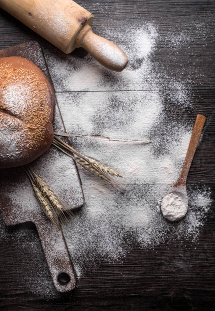 istock Fresh bread on a wooden background 698967678