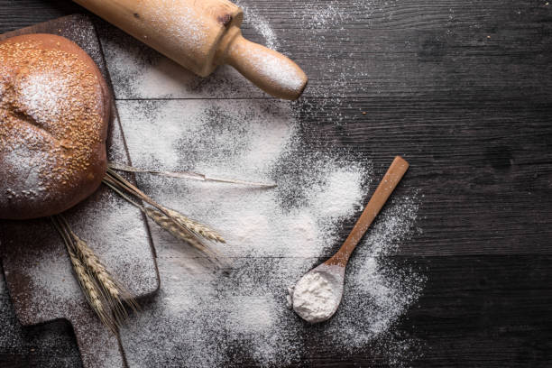 istock Fresh bread on a wooden background 698971638