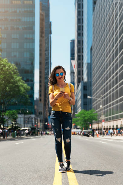 istock Beautiful woman using phone. 698974464