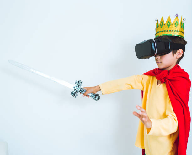 istock Young boy play the video game with Virtual Reality 699083920