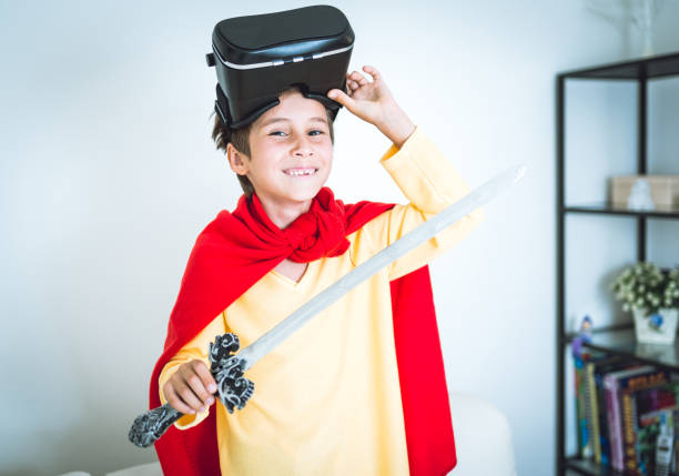 istock Young boy play the video game with Virtual Reality 699083942