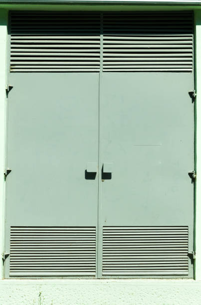 istock Protective metal doors of transformer station electric cabinet. Vertical. 699084324