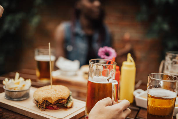 istock Close up on persons hand holding a beer jug 699087002