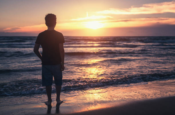 istock Watching beautiful sunset near sea 699091602