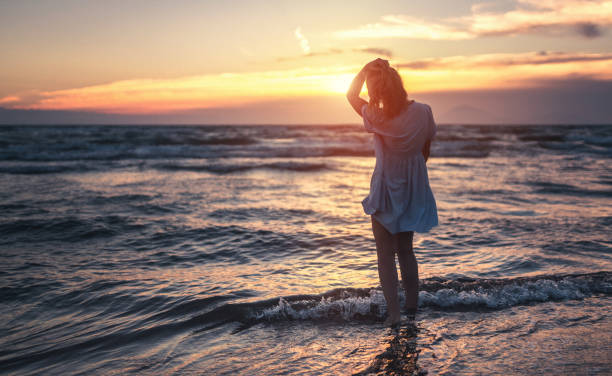 istock Watching beautiful sunset near sea 699091608