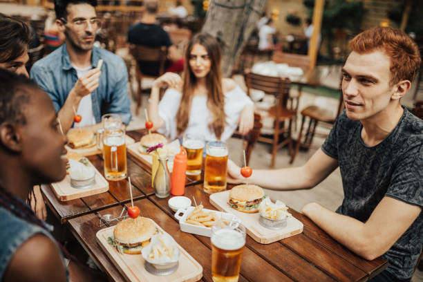 istock Group of multi-raced people at the pub are having fun together 699093202