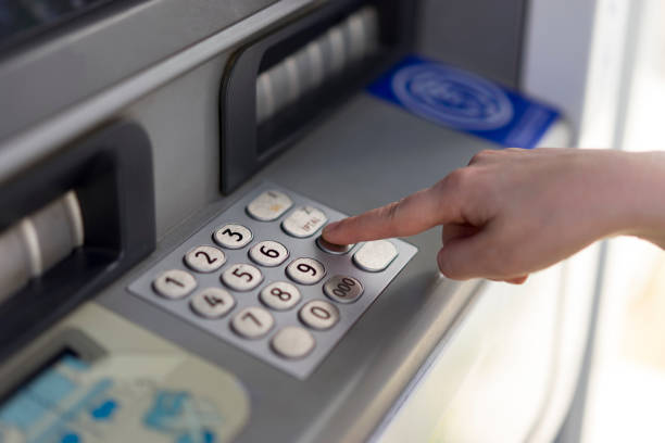 istock Woman withdraws money from an atm 699093294