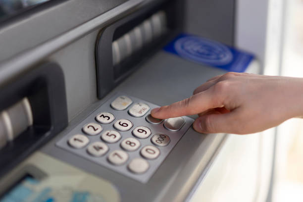 istock Woman withdraws money from an atm 699093618