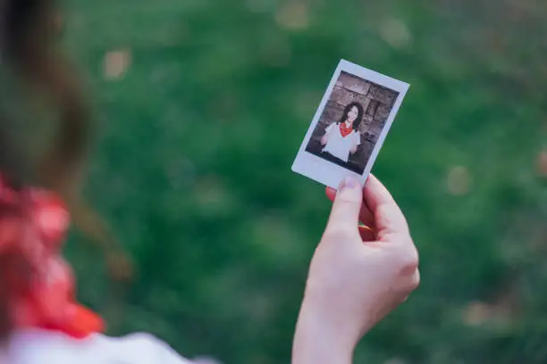 Photo of Girl showing instant photo