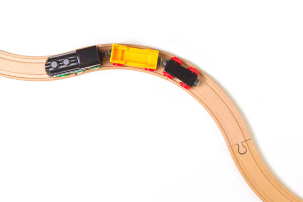 istock Toy train and wooden rails on white background. Top view. Copy space for text 699104962