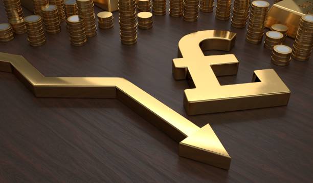 istock Golden pounds symbol and arrow down. 3D rendered illustration. 699134400