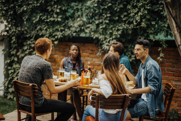 istock Multi-ethnic group of friends gathered at the pub 699136496